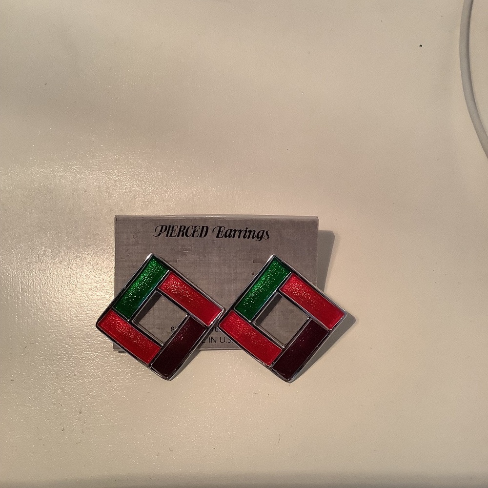 A pair of silver and enamel pierced earrings